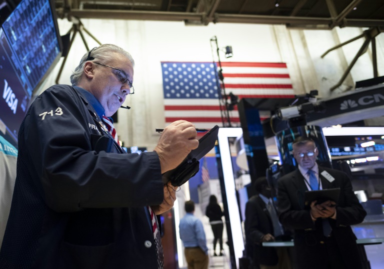 Late Surge Lifts Wall Street Stocks Admist Virus Attacks