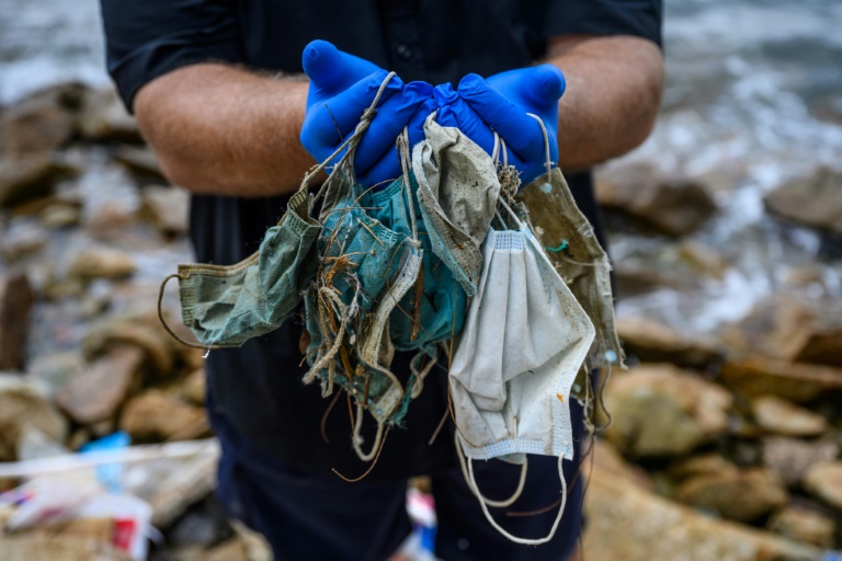 Anti-virus face masks plague Hong Kong's beaches