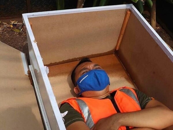 COVID-19 Protocol Violators Made To Sit In Caskets (1)